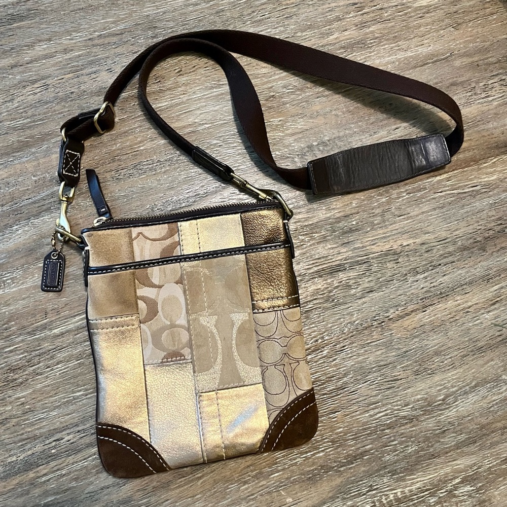 Coach cross body purse. Gold.